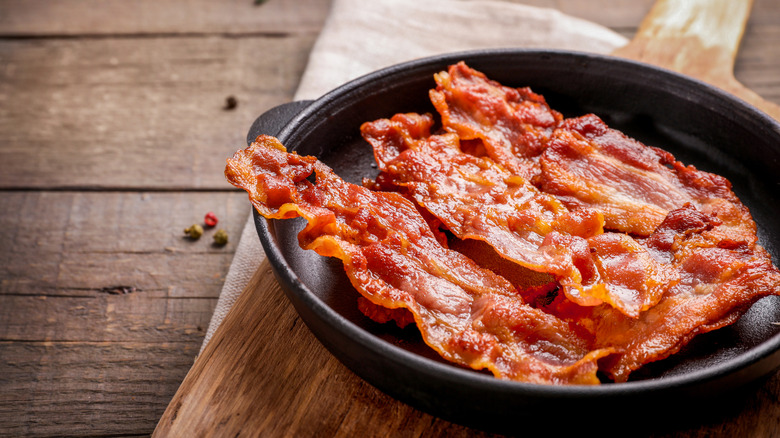 Cooked bacon in a cast-iron pan