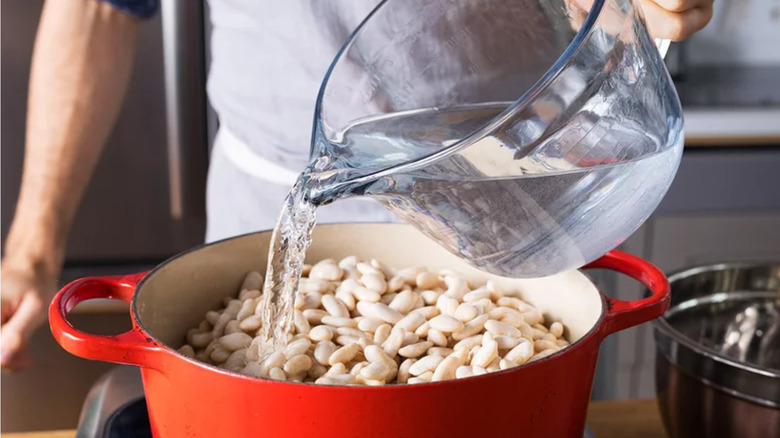 Water being poured on beans