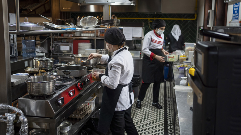 Employees working in a kitchen