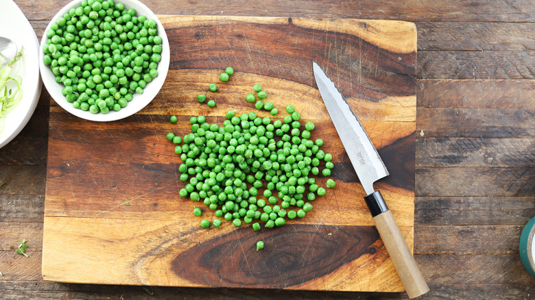 Chopping peas on board