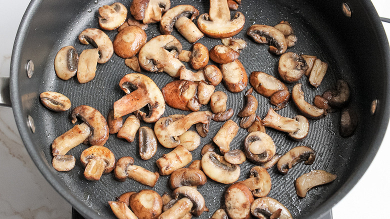 mushrooms cooking in pan