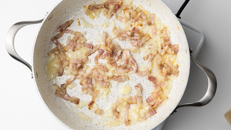 onion and bacon in pan 