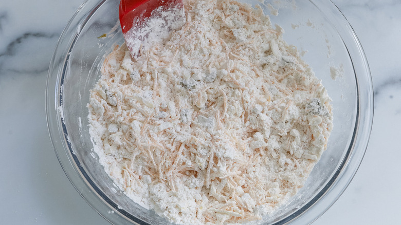 shredded cheese in flour mixture