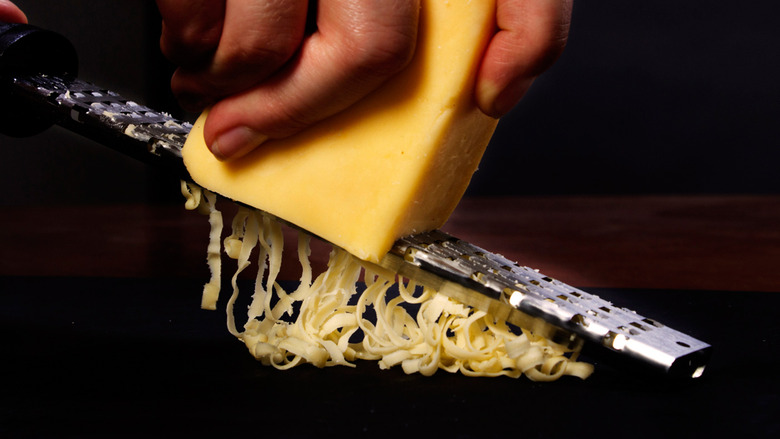 https://www.tastingtable.com/img/gallery/cheese-grater-clean-with-pastry-brush-trick/image-import.jpg