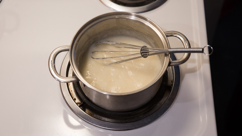 grits simmering in saucepan