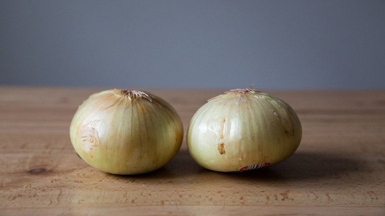 2 Vidalia onions on table 