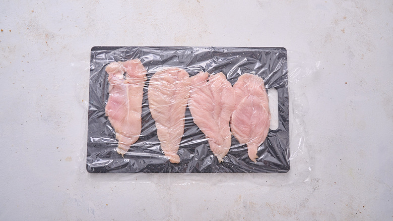 tenderizing chicken in plastic wrap