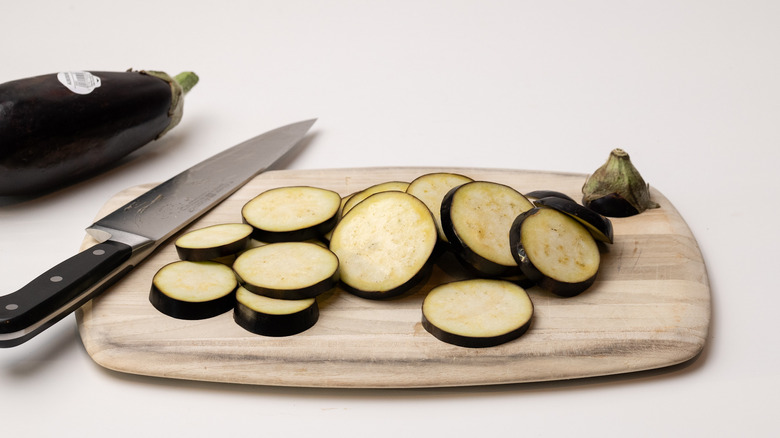 sliced eggplants on chopping board