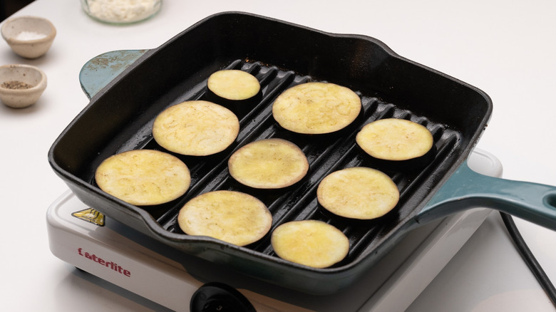 eggplant slices in griddle pan