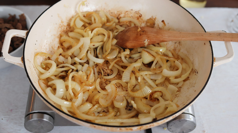onions browning in a pan