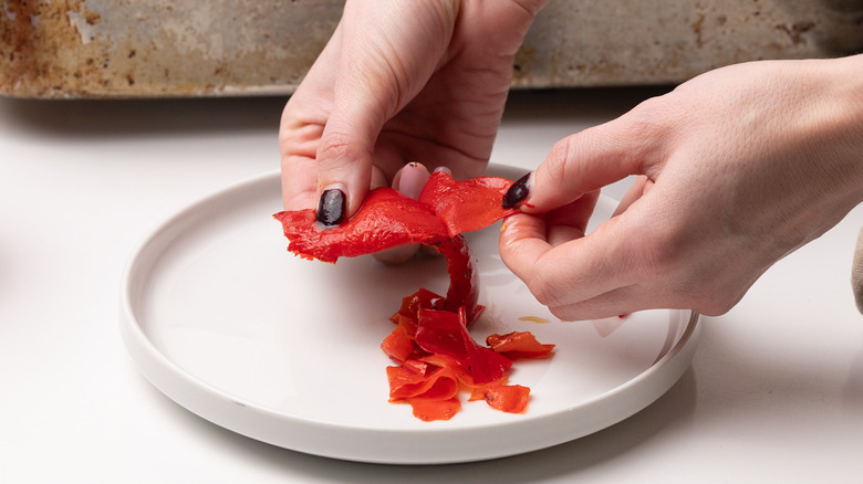 peeling skin from roasted peppers