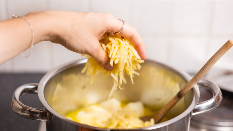 cheddar going into pot 