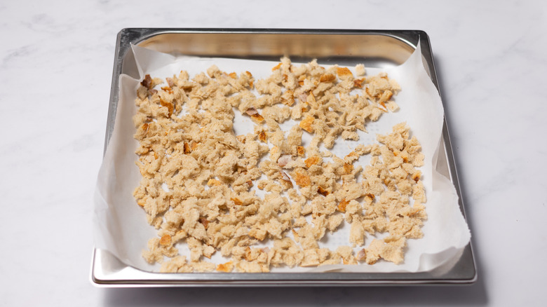 crumbled sourdough on tray 