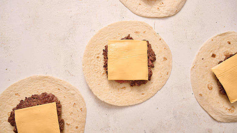 burger and cheese on tortilla