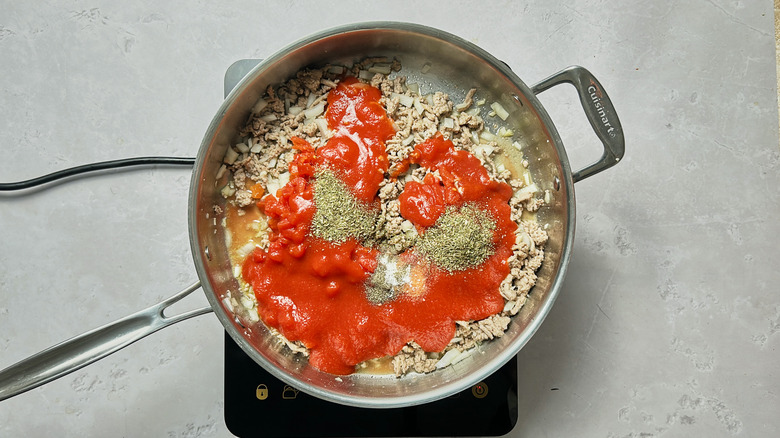 tomato and seasonings in skillet