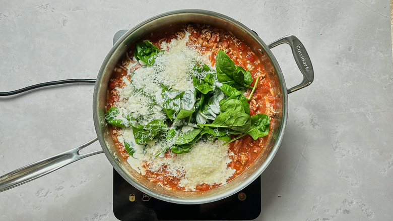 parmesan and spinach in skillet