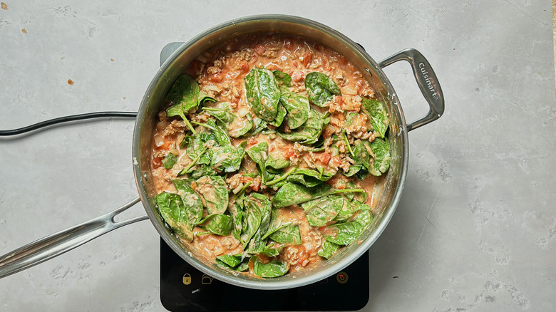 cooked spinach in sauce