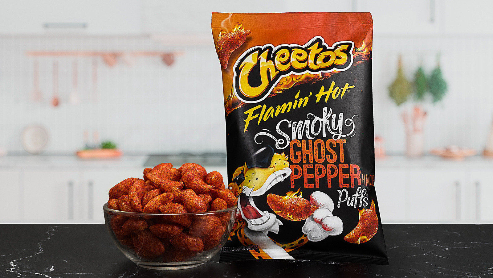 https://www.tastingtable.com/img/gallery/cheetos-announces-limited-edition-flamin-hot-smoky-ghost-pepper-puffs/l-intro-1684360132.jpg