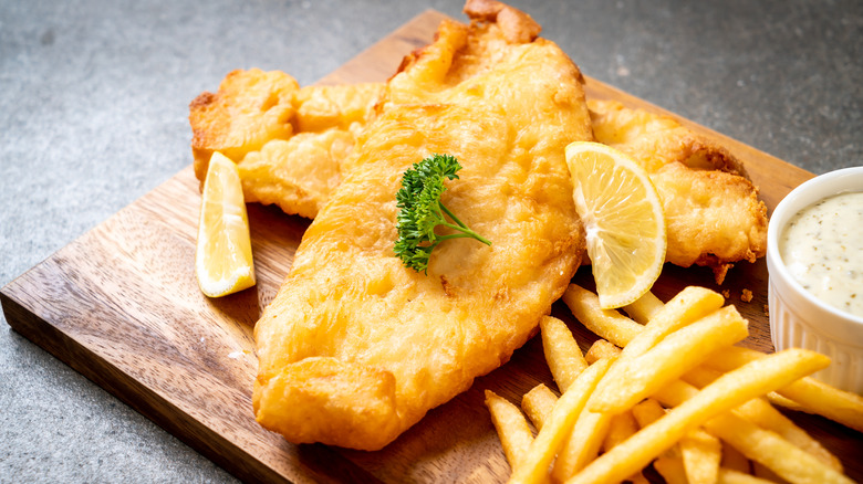 Fish and chips on wooden board