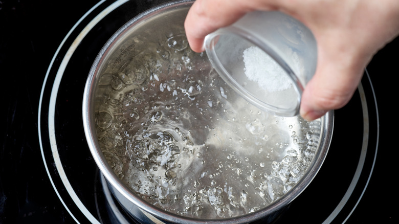 Adding salt to boiling water