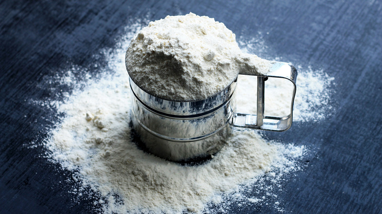 Cup of flour on counter