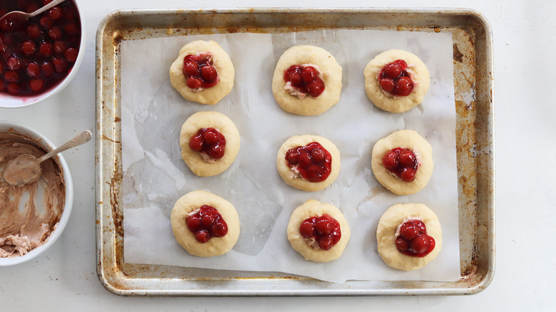 cherries on top of dough