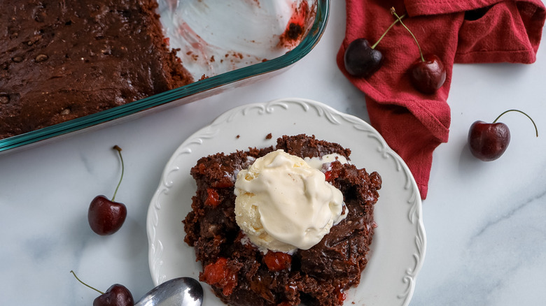 cherry cola dump cake being served on a plate