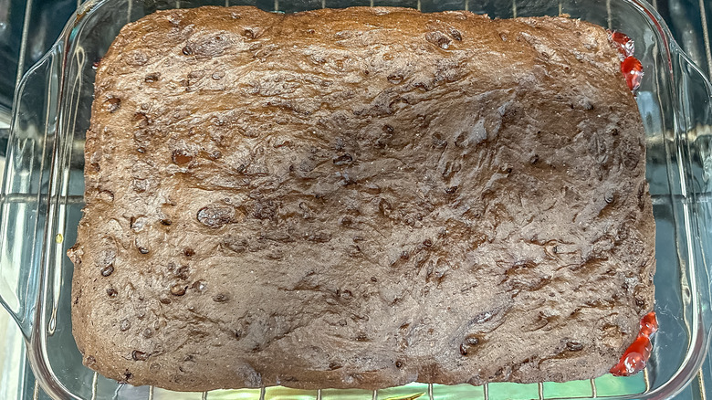 chocolate cake in pan in oven