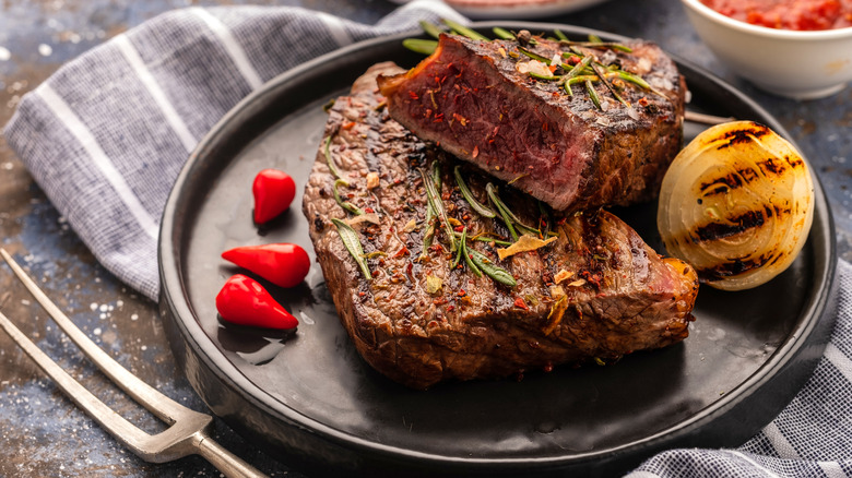 plate of steak with cherry peppers 