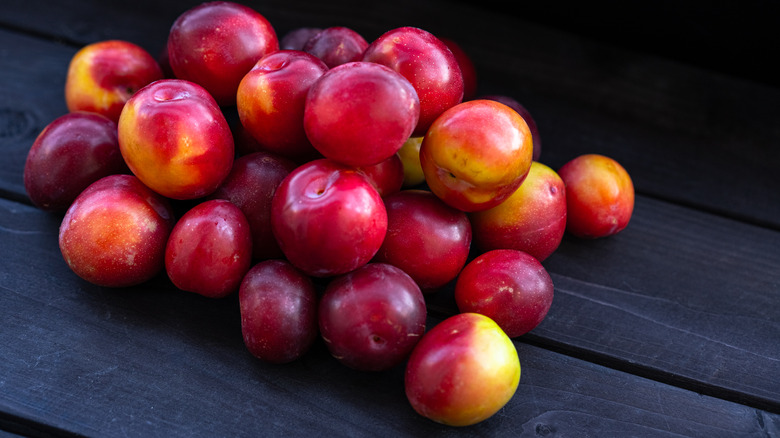 Pile of red cherry plums