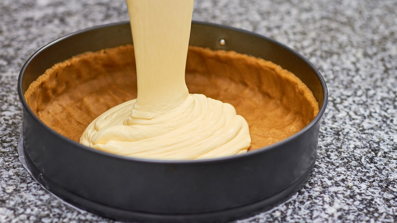 Pouring batter into pie crust