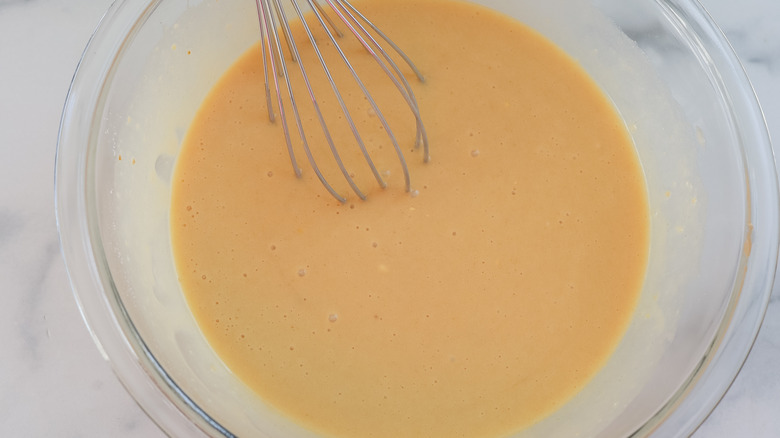 Coconut bar filling whisked in a bowl