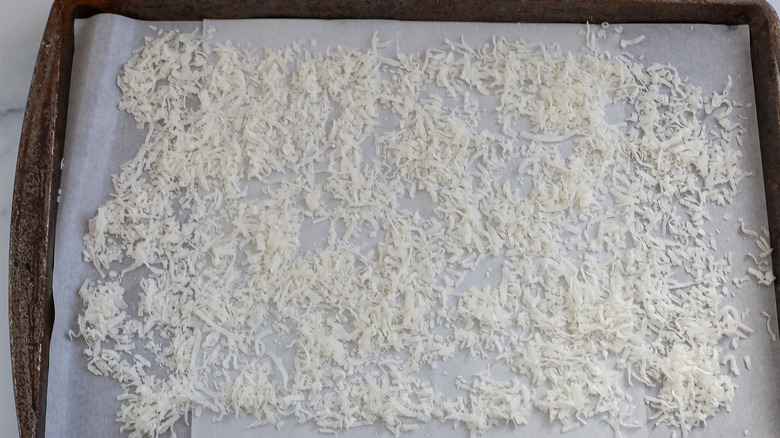 shredded coconut on a sheet pan