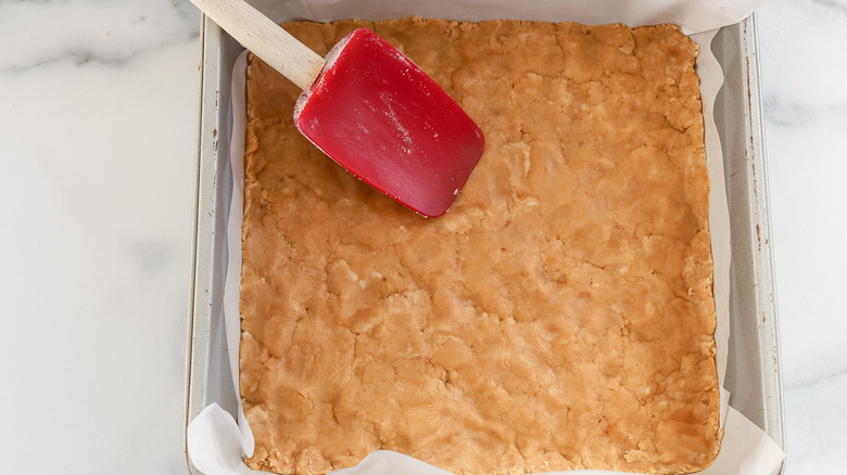 coconut bar crust pressed into a pan