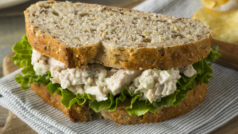 Homemade chicken salad sandwich on cloth