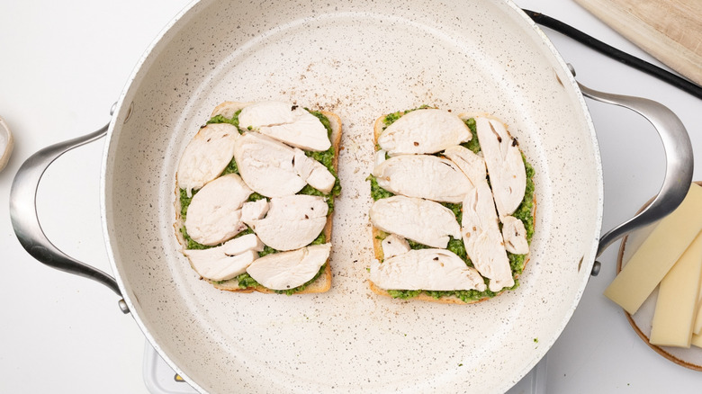 assembling sandwich in a pan