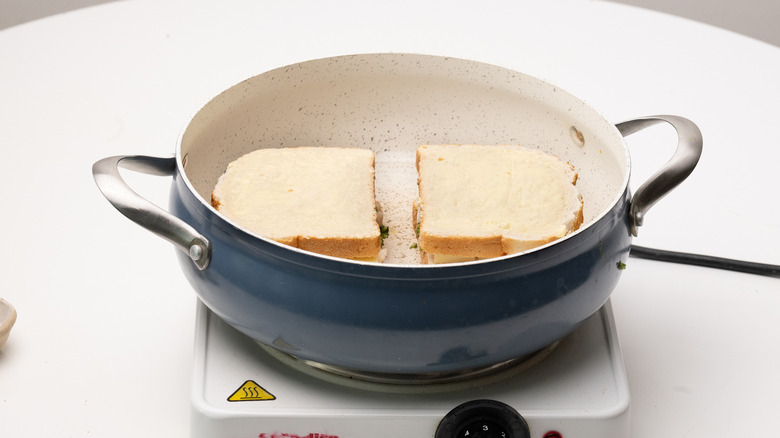 toasting sandwiches in a pan