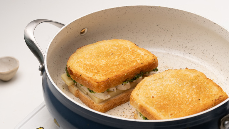 sandwiches toasting in a pan