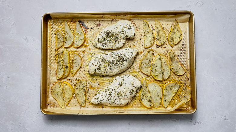 chicken and pears on baking sheet