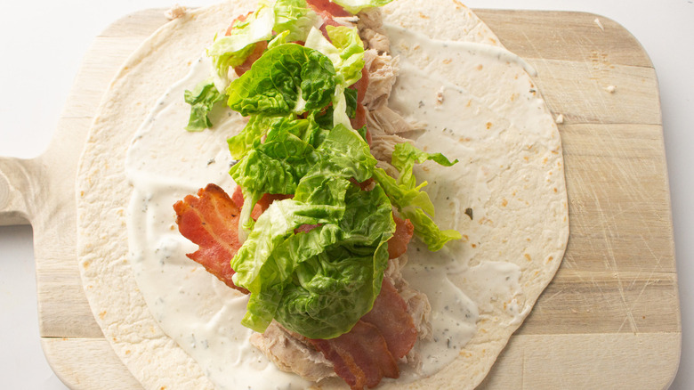 wrap sandwich ingredients on tortilla