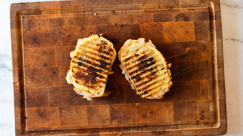 grilled panini sandwiches on cutting board