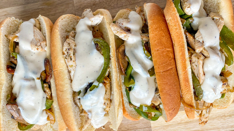 chicken cheesesteak sandwiches lined up