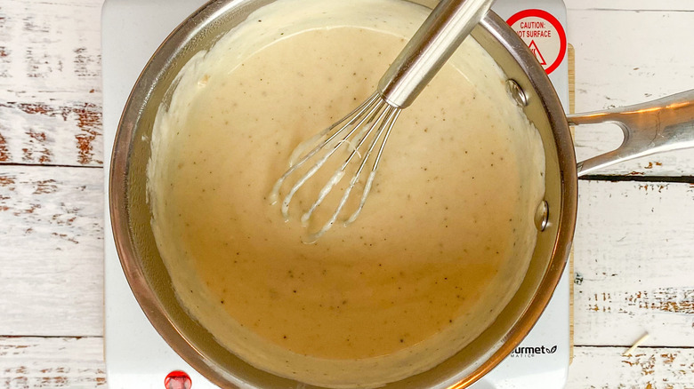 cheese sauce in saucepan 