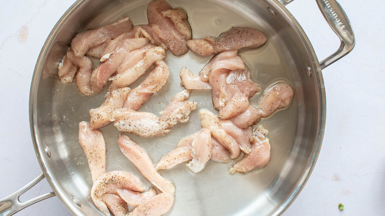 chicken pieces in metal pan