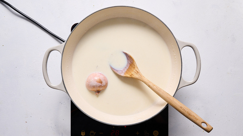 mornay sauce simmering in skillet