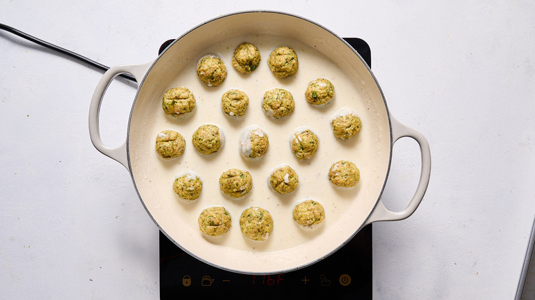 stirring meatballs into skillet