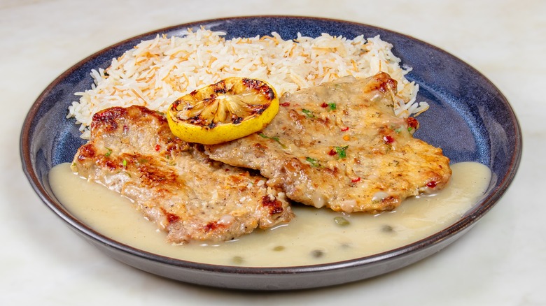 Chicken cutlet, lemon, and rice