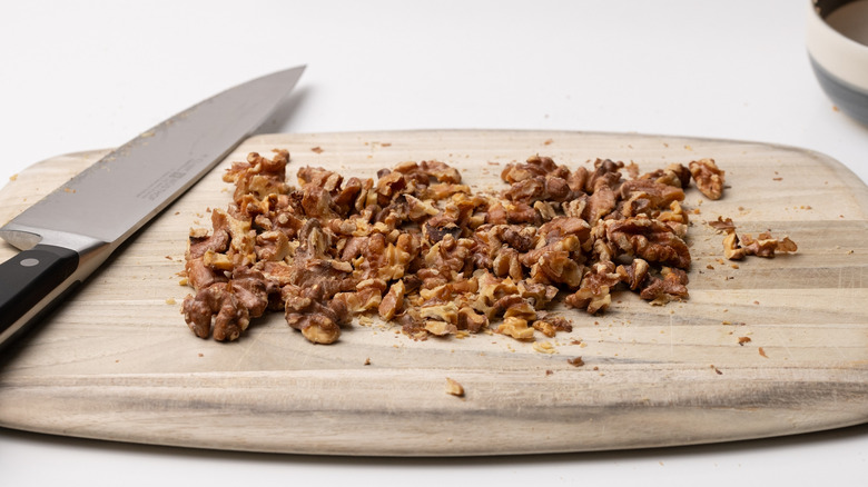 chopped walnuts on a board