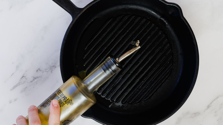 Adding oil to grill pan