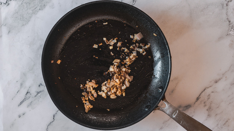 Shallots and garlic in pan